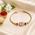 Traditional swastik charm rakhi with red beads