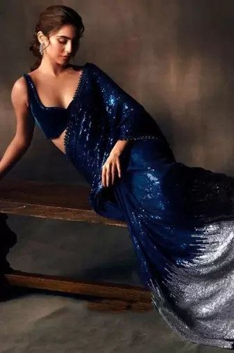 Navy blue heavy georgette sequins embroidered saree with cutwork lace border & silk blouse