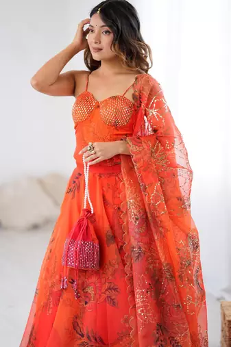 Orange Organza Corset Lehenga Set with Batwa Bag