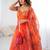 Orange Organza Corset Lehenga Set with Batwa Bag