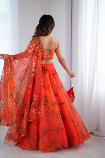 Orange Organza Corset Lehenga Set with Batwa Bag