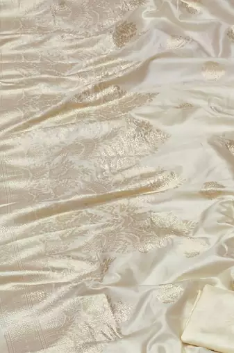 cream zari woven banarasi silk blend traditional saree with blouse piece