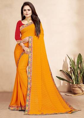 yellow color bandhni print saree with embroidered lace border sarees 1