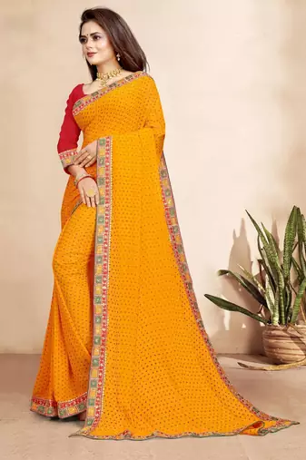 yellow color bandhni print saree with embroidered lace border sarees