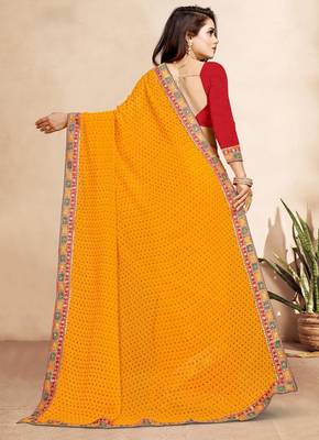 yellow color bandhni print saree with embroidered lace border sarees 4