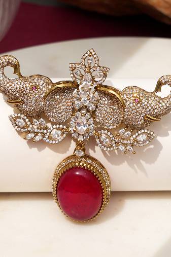 Gold plated red stone elephant head brooch