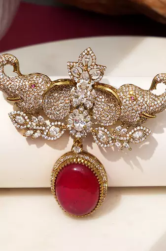 Gold plated red stone elephant head brooch