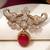 Gold plated red stone elephant head brooch