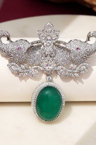 Rhodium plated green stone elephant head brooch