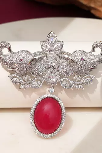 Rhodium plated ruby red stone elephant head brooch