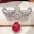 Rhodium plated ruby red stone elephant head brooch