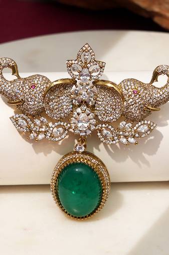 Gold plated emerald green stone elephant head brooch