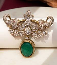 Gold plated emerald green stone elephant head brooch