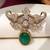 Gold plated emerald green stone elephant head brooch