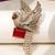 Gold plated ruby red stone bird motif brooch