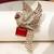 Gold plated ruby red stone bird motif brooch