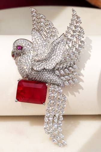 Rhodium plated ruby red stone bird motif brooch