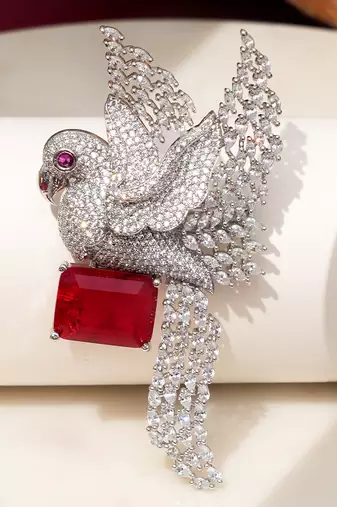 Rhodium plated ruby red stone bird motif brooch
