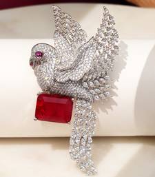 Rhodium plated ruby red stone bird motif brooch