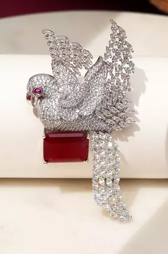 Rhodium plated ruby red stone bird motif brooch