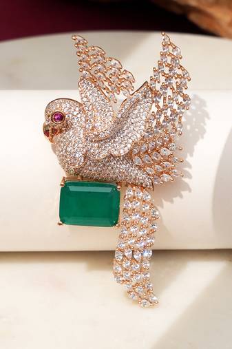 Gold plated green stone bird motif brooch