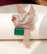 Gold plated green stone bird motif brooch