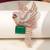 Gold plated green stone bird motif brooch