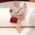 Gold plated red stone bird motif brooch