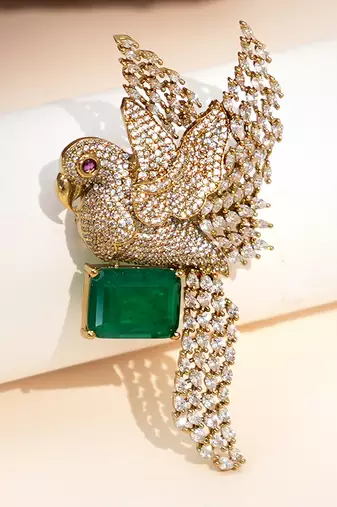 Gold plated green stone bird motif brooch