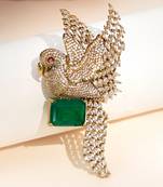 Gold plated green stone bird motif brooch