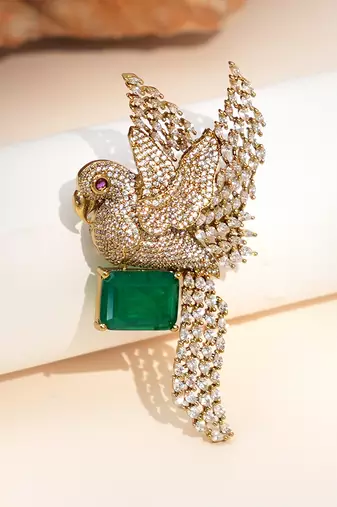 Gold plated green stone bird motif brooch