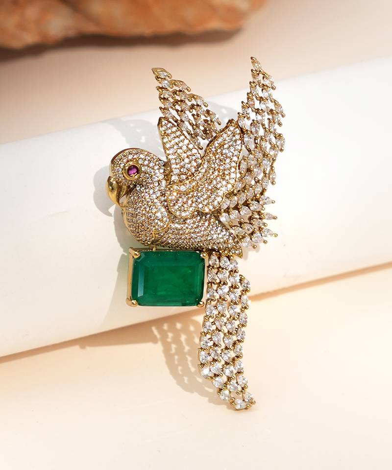 Gold plated green stone bird motif brooch