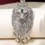 Silver plated green stone lion head brooch