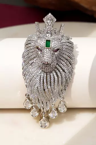 Silver plated green stone lion head brooch
