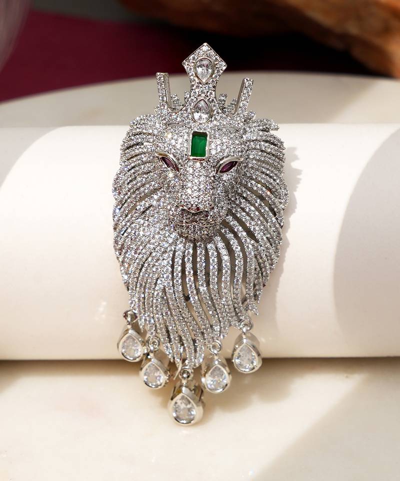 Silver plated green stone lion head brooch