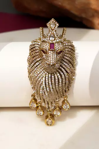 Gold plated purple stone lion head brooch