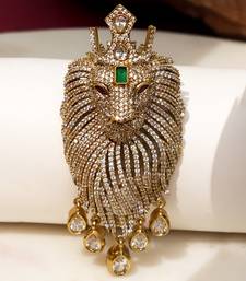 Gold plated green stone lion head brooch