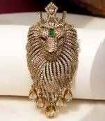 Gold plated green stone lion head brooch