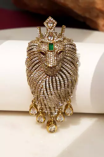 Gold plated green stone lion head brooch