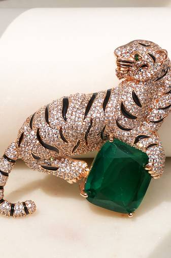 Gold plated emerald green stone crouching tiger brooch