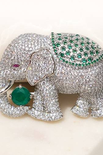 Silver plated green stone royal elephant brooch