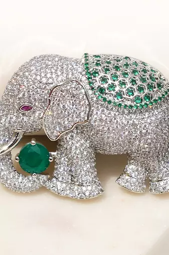 Silver plated green stone royal elephant brooch