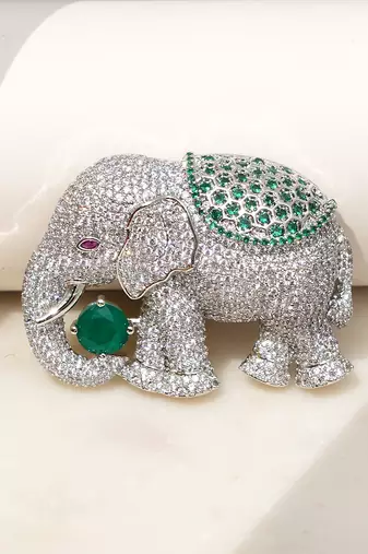 Silver plated green stone royal elephant brooch