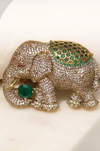 Gold plated emerald green stone royal elephant brooch