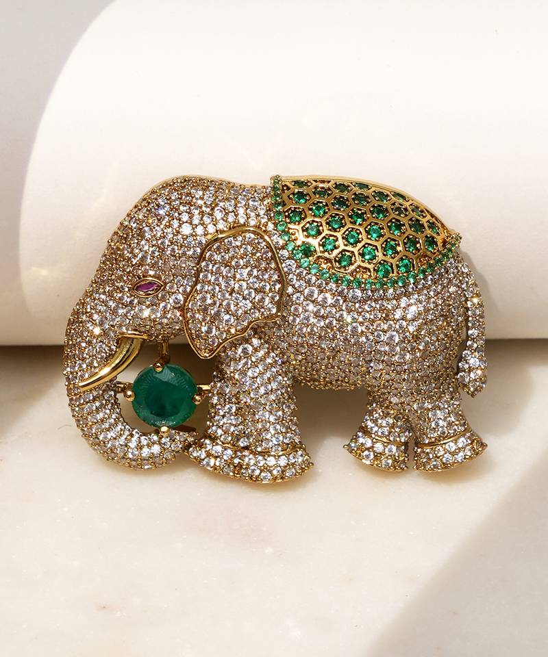 Gold plated emerald green stone royal elephant brooch