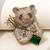 Gold plated emerald green stone bear motif brooch