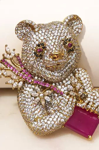Gold plated purple stone bear motif brooch