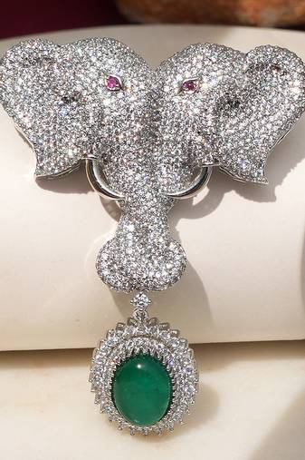 Silver plated green stone twin elephant brooch
