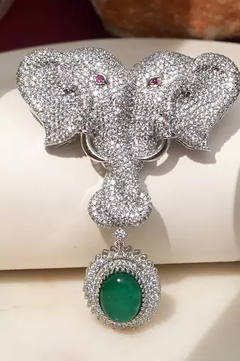 Silver plated green stone twin elephant brooch
