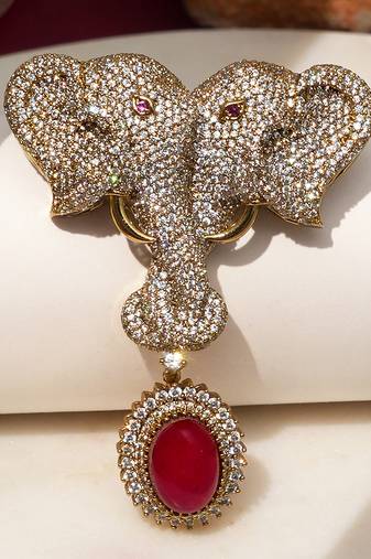 Gold plated ruby red stone twin elephant brooch